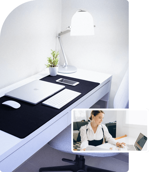 Tidy home office workspace with laptop, phone, and desk lamp